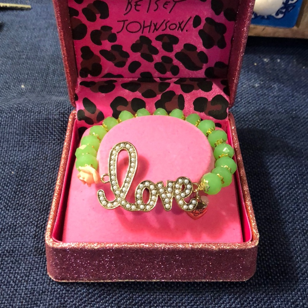 Betsey Johnson “Love” bracelet.